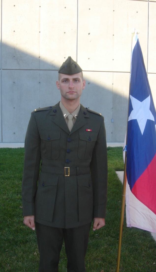 Dress uniform beside a Texas flag, early in his career